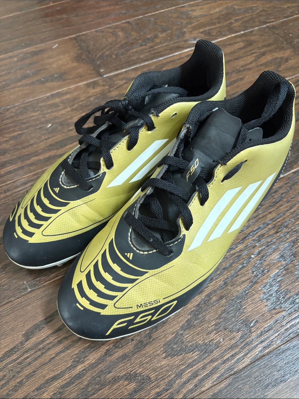 adidas Men’s F50 Messi gold and black soccer cleats